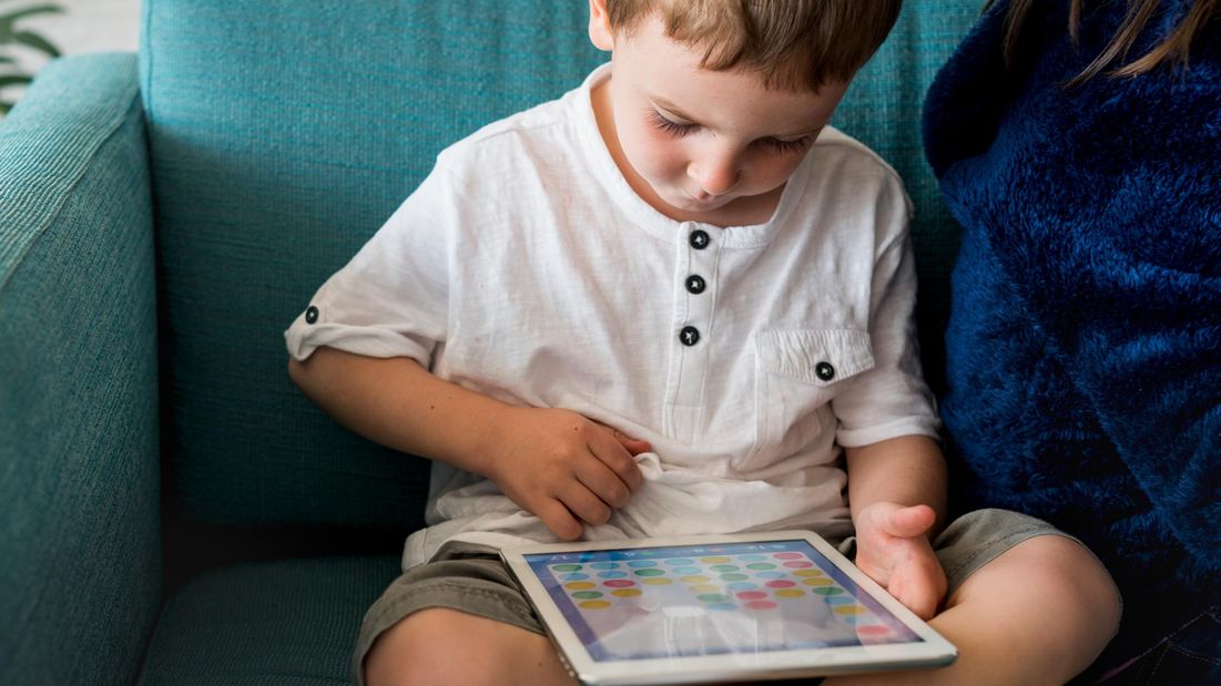A boy using a tablet