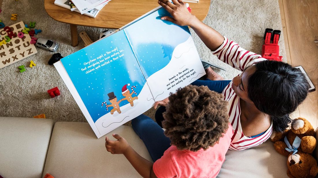 A younger child reading a book